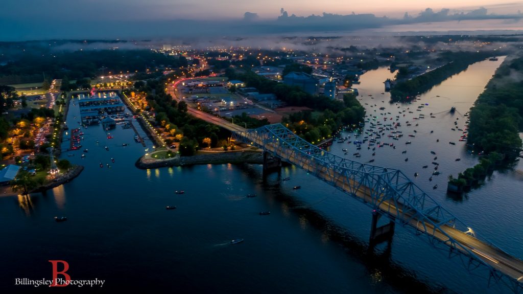 Hundreds of boats on the Tennessee River at night near McFarland Park.