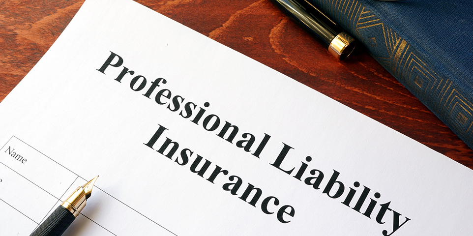 Professional liability insurance policy on a table.